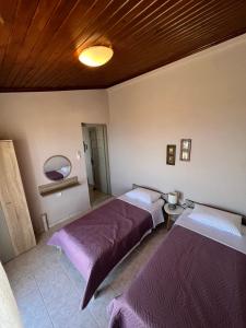 A bed or beds in a room at Anatolí Village House