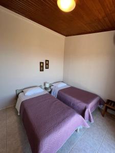A bed or beds in a room at Anatolí Village House