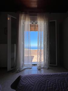 A bed or beds in a room at Anatolí Village House