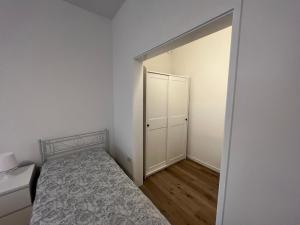A bed or beds in a room at Casa Roma rooms& apartmens