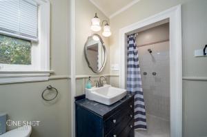 a bathroom with a sink and a mirror at Garage apartment 5 min from Downtown in Abilene