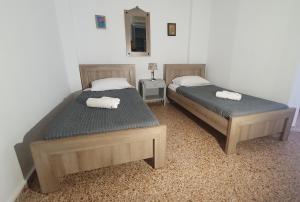 A bed or beds in a room at Toulipa Lindos