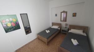 A bed or beds in a room at Toulipa Lindos