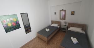 A bed or beds in a room at Toulipa Lindos
