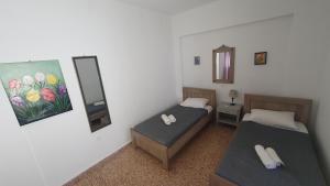 A bed or beds in a room at Toulipa Lindos