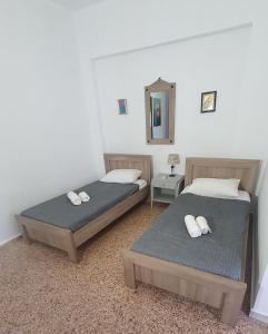 A bed or beds in a room at Toulipa Lindos