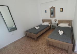 A bed or beds in a room at Toulipa Lindos