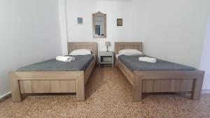 A bed or beds in a room at Toulipa Lindos