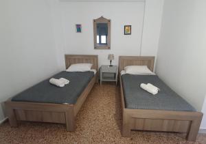 A bed or beds in a room at Toulipa Lindos