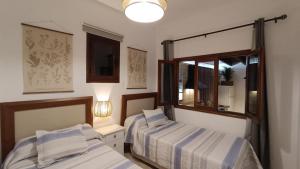 Cama ou camas em um quarto em Casa Isabel 2