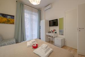TV a/nebo společenská místnost v ubytování Damiani & Sister Guesthouse