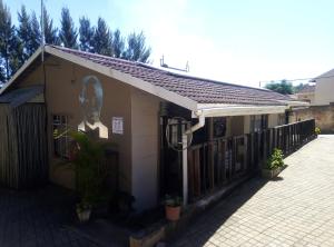 a building with a mural of a woman on it at Big Five Guest House in Mthatha