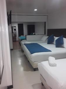 En eller flere senger på et rom på Hotel Casa Lamay