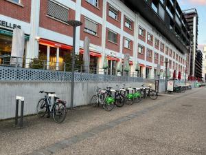 a row of bikes parked in front of a building at Mandana in Strasbourg