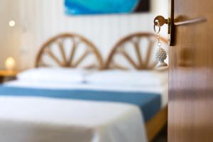 Letto o letti in una camera di L'Aurora Scala Dei Turchi