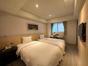 Voodi või voodid majutusasutuse Link World Hotel toas