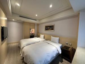 Voodi või voodid majutusasutuse Link World Hotel toas