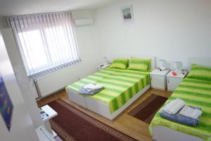 Postel nebo postele na pokoji v ubytování Rooms Busujok