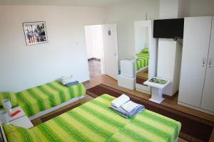 Postel nebo postele na pokoji v ubytování Rooms Busujok