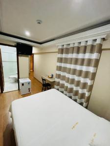 Cama ou camas em um quarto em Gran Chevalier Hotel