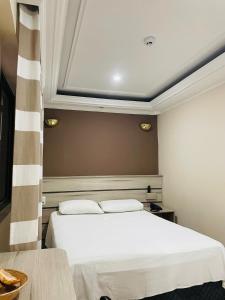 Cama ou camas em um quarto em Gran Chevalier Hotel