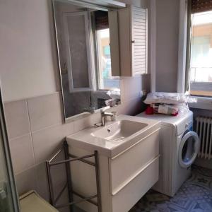 a bathroom with a sink and a washing machine at Daniele's flat in Venice Mestre in Mestre