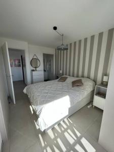 a bedroom with a large bed in a room at Roses Marines A136 By Avecoeur in Grasse