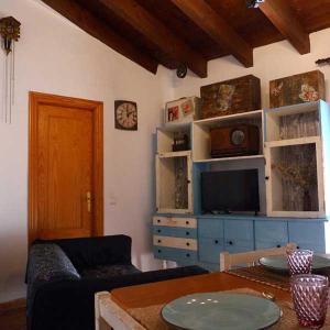 a living room with a couch and a table at Apartamentos Casa Mata in Colungo