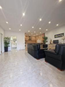 a large living room with couches and a kitchen at Quinta do Baía in Lagos +47 photos