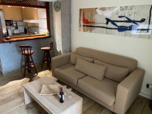 a living room with a couch and a table at Albaida Estepona in Estepona