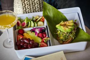 a tray of fruit and vegetables and a glass of wine at Coronado Island Marriott Resort & Spa in San Diego