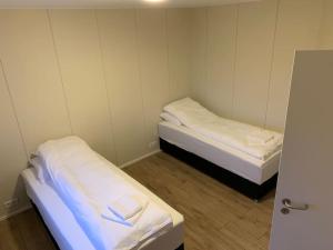 Postel nebo postele na pokoji v ubytování Hótel Hafnir + 13 fotografií