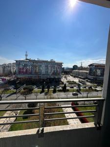 een balkon met uitzicht op de stad bij Great location two bedroom apatment ''MAXIM'' in Podgorica