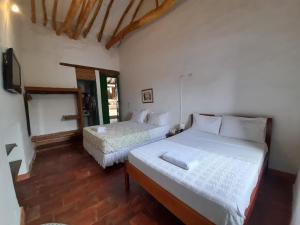 Una cama o camas en una habitación de Posada Sueños de Antonio