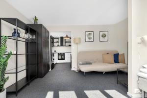 a bedroom with a bed in a room at Central Studio Apartment in Stavanger in Stavanger