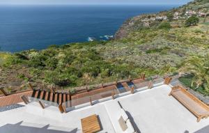 a house with a view of the ocean at Serenity Villa on the Cliff with climatized pool in Sauzal