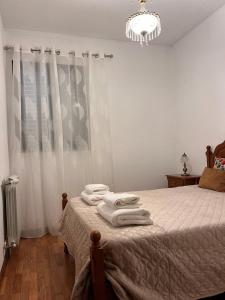 Postel nebo postele na pokoji v ubytování Casa de Sergude