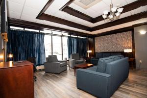 a waiting room with couches and chairs and a table at Best Western Plus Plattsburgh in Plattsburgh