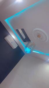 a blue light on the ceiling of a room at Emefa Room in Cotonou