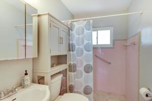 a bathroom with a toilet and a sink and a shower at Waterfront Okeechobee Getaway with Backyard Dock! in Okeechobee +27 photos