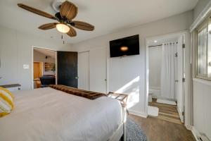 a bedroom with a bed and a ceiling fan at Broadmoor Getaway with Pickleball Court! in Colorado Springs