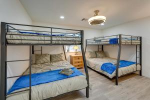 a bedroom with two bunk beds and a desk at Pool, Spa and Mtn Views Lake Havasu City Home in Lake Havasu City +30 photos