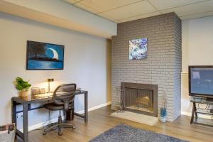 a room with a desk and a fireplace at Portland Vacation Rental about 11 Miles to Downtown in Portland