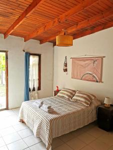 a bedroom with a bed with a teddy bear on it at Doña Isabel 2 in Gualeguay