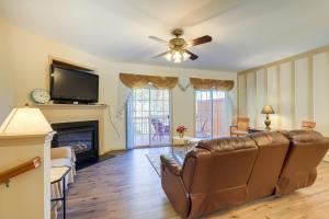 a living room with a couch and a fireplace at Decatur Vacation Rental about 5 Mi to Downtown Decatur in Decatur