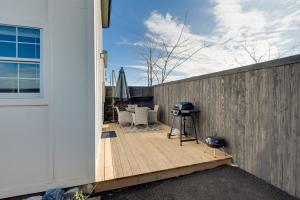 a backyard deck with a grill and a fence at Pet-Friendly Bowie Studio with Deck! in Bowie