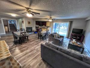 a living room with a couch and a table at Sunny Shuswap B&B in Chase