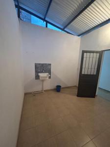 a bathroom with a sink in a white wall at Departamento Céntrico in Chilecito
