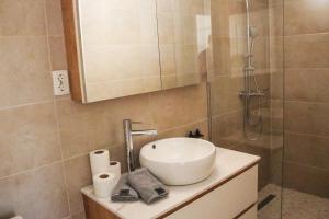 a bathroom with a sink and a shower at Villa Christina 2 in Ohrid