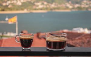 two cups of coffee sitting on a table at Villa Christina 2 in Ohrid